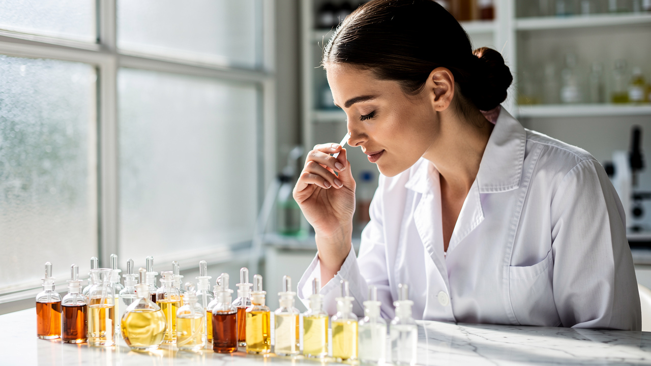 Professional perfumer developing a signature brand scent